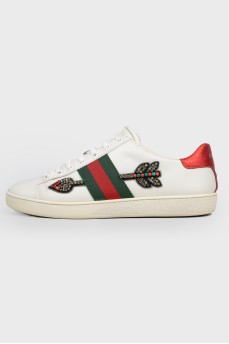 White leather sneakers with colored inserts