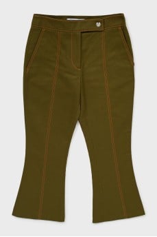 Green flared trousers with tag