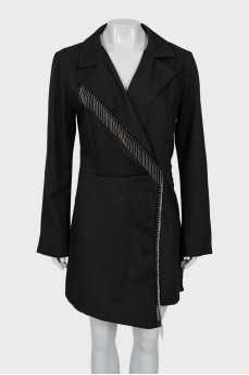 The jumpsuit with shorts is decorated with fringe
