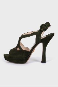 Green sandals with a figured heel