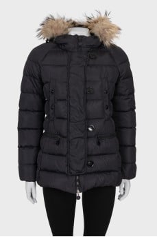Jacket with a hood decorated with fur