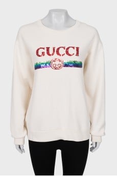 Beige sweatshirt decorated with sequins