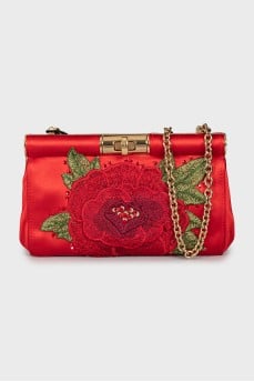Clutch decorated with embroidery on a chain