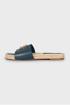 Leather flip flops with rhinestones on the logo