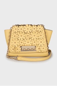 Leather bag decorated with flowers