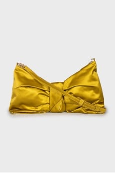 Textile bag in the form of a bow