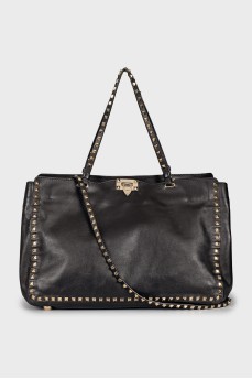 Leather bag decorated with spikes