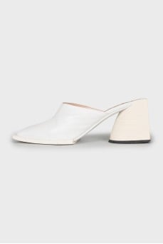 White mules with a figured heel