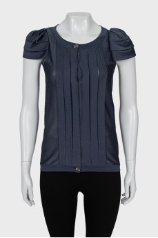 Blouse decorated with pleats