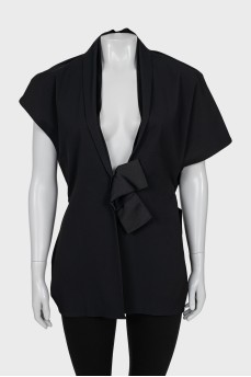 Vest decorated with a silk bow