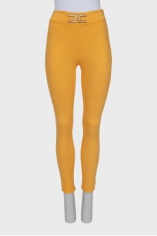 Yellow trousers with massive logo