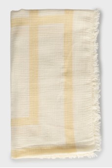 Yellow scarf with branded print and tag