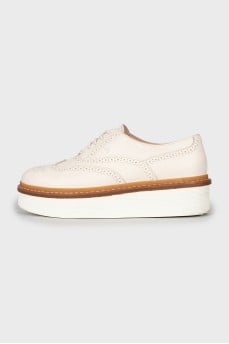 White leather brogues with perforations