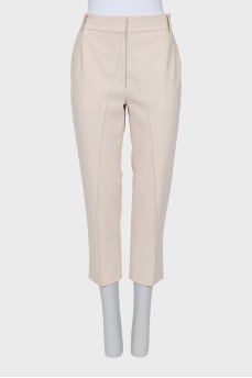 Straight-leg pink trousers with creases