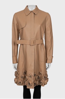 Leather trench coat decorated with flowers