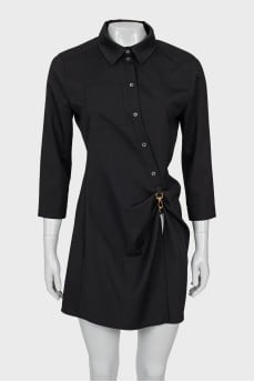 Dress decorated with a carabiner with a tag