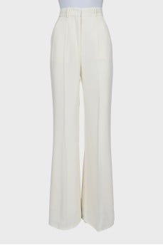 White flared trousers