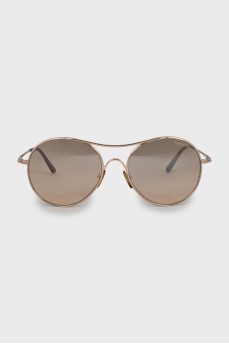 Сонцезахисні окуляри у золотистій оправі