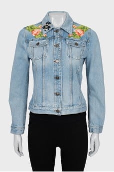 Denim jacket decorated with embroidery