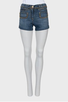 Denim shorts decorated with chains