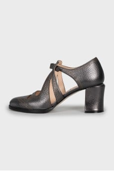 Silver shoes with relief pattern