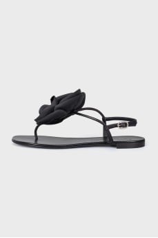 Black sandals decorated with a flower