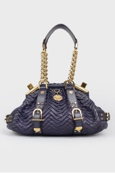 Texture bag with golden fittings