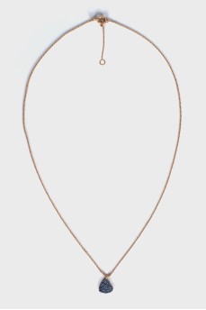 Gold pendant with sapphires