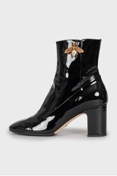 Patent leather ankle boots with signature decor