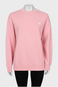 Pink sweatshirt with branded patch