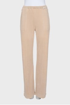 Beige trousers with relief stitching