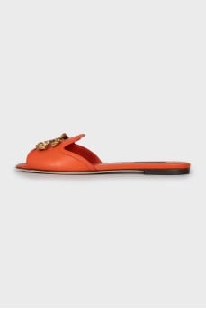 Orange leather slippers with decor