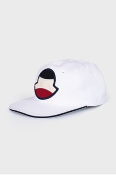 White cap decorated with a patch