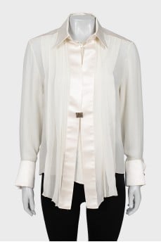 Silk blouse decorated with pleats