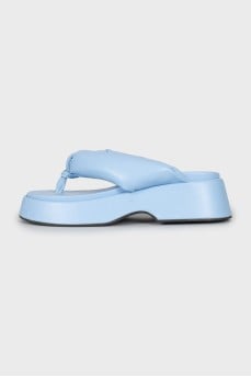 Blue flip flops with high soles