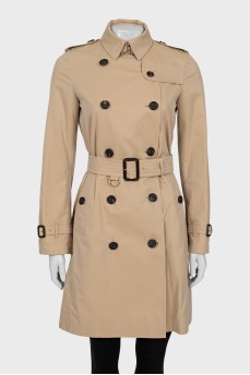 Beige trench coat with branded buttons
