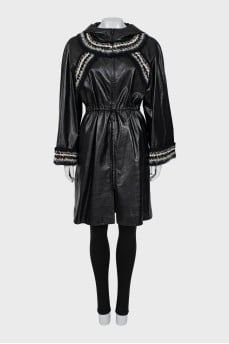 Leather coat with knitted elements