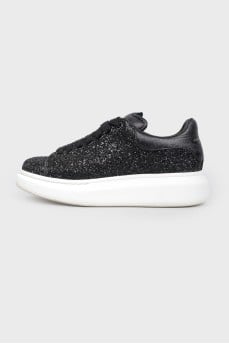 Black sneakers with white thick sole