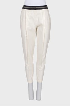 Tapered trousers with a decorated waist