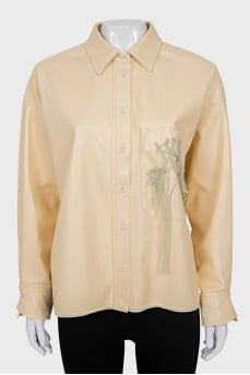 Shirt with patch pocket with embroidery