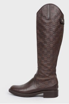 Boots with embossing in the form of a logo