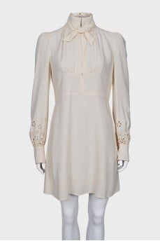 Dress with perforated sleeves