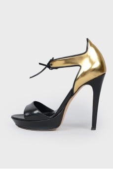 Sandals with a closed golden heel
