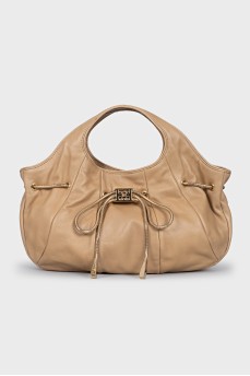Bag decorated with a golden bow