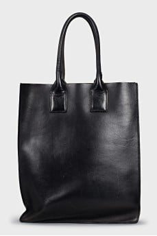 Leather bag decorated with tassels