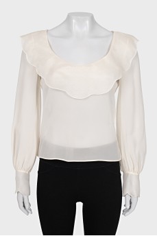 White blouse with a figured collar