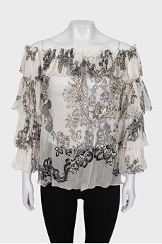 Sheer blouse with printed pleats