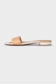 Beige leather flip flops