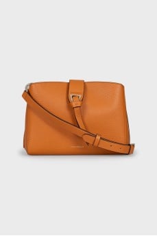 Orange leather bag with tag