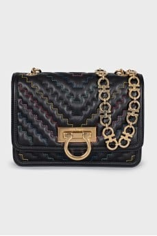 Leather bag on a gold chain